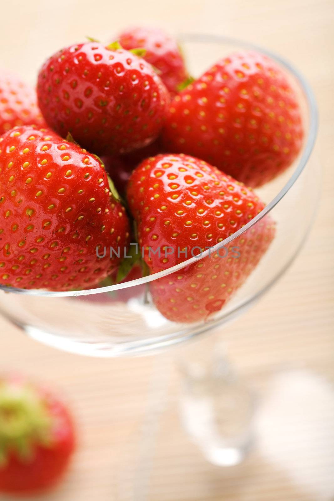 ripe strawberries in glass bowl