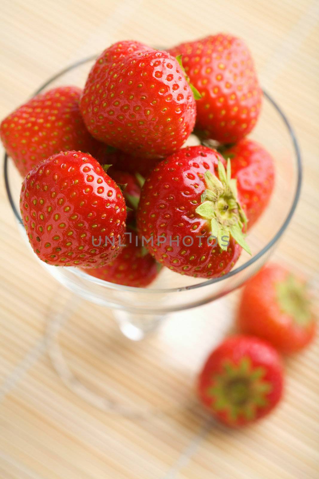 ripe strawberries in glass bowl