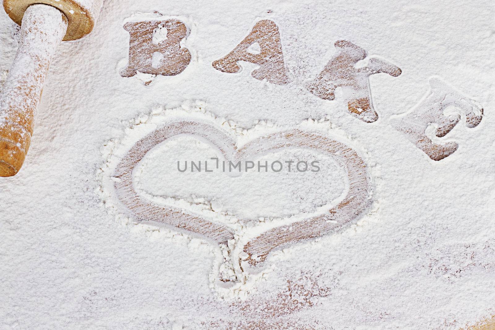 White flour with word bake and hand drawn heart. 
