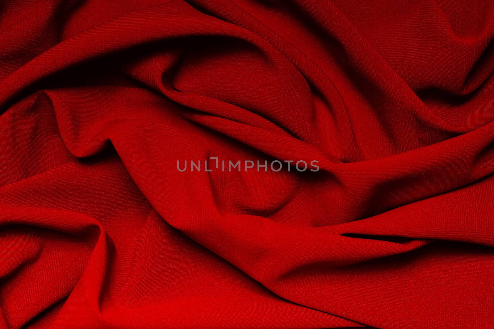 The folds of a bright red cloth. Abstract Background