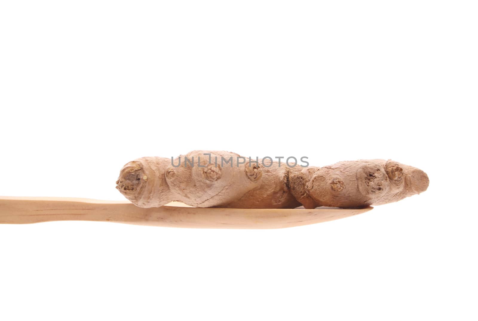 simply offered on a wooden spoon isolated on a white background 