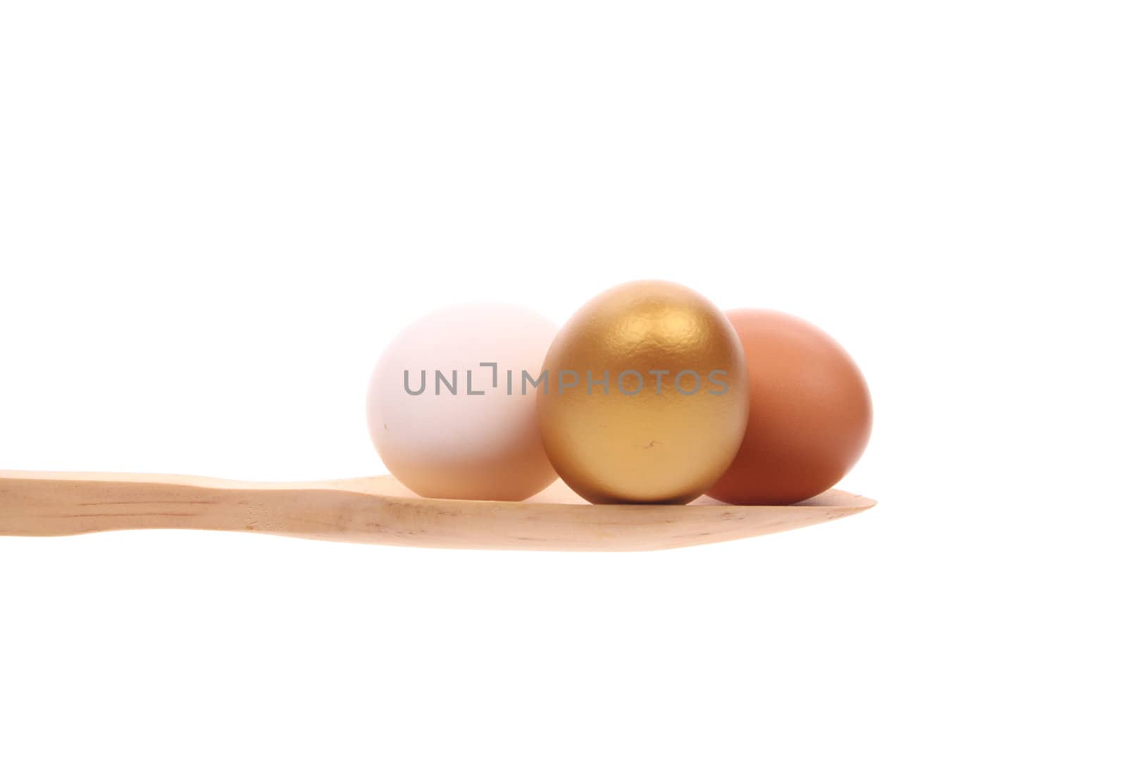 Eggs simply offered on a wooden spoon isolated on a white background 