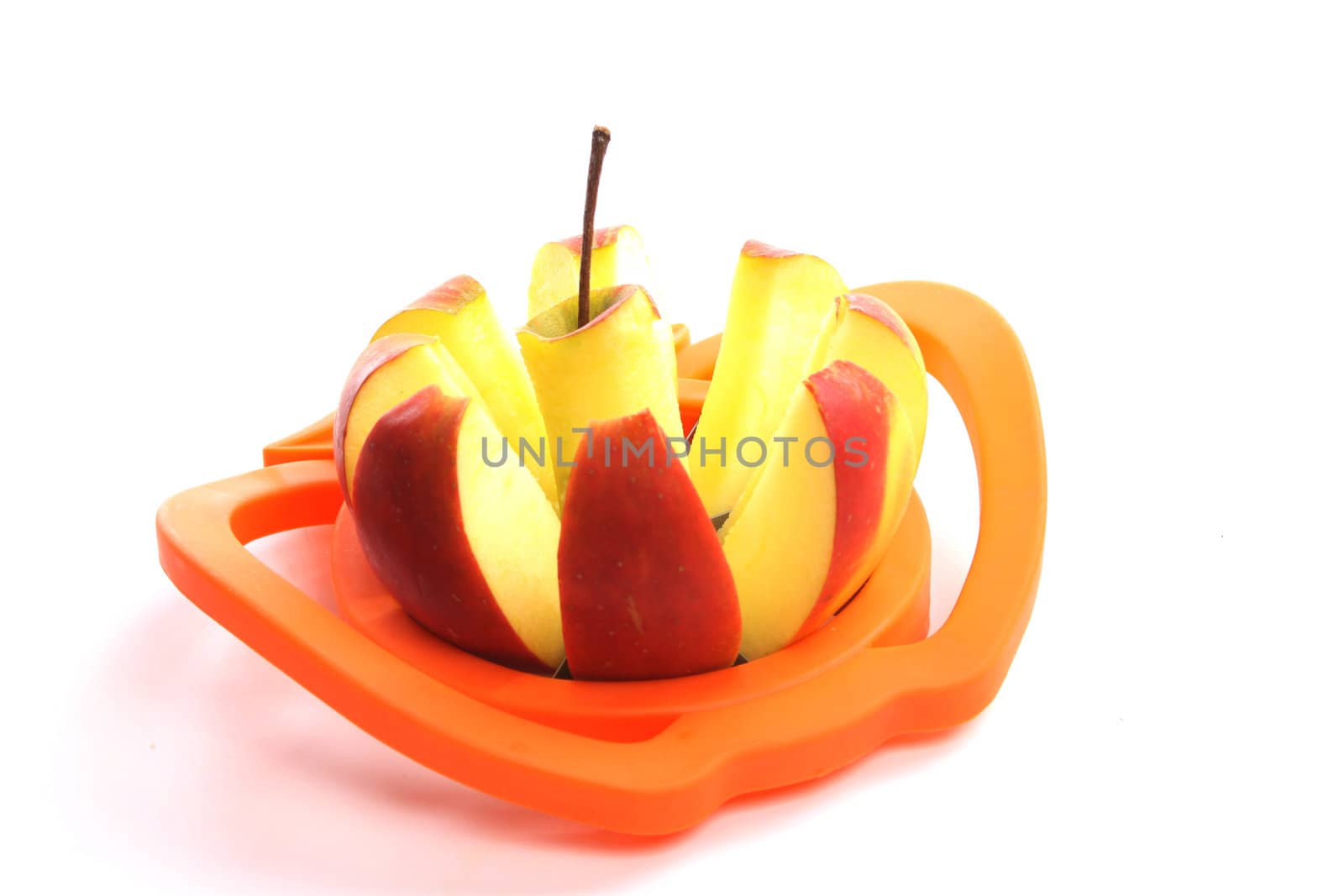 Cut apple  simply offered on a wooden spoon isolated on a white background 