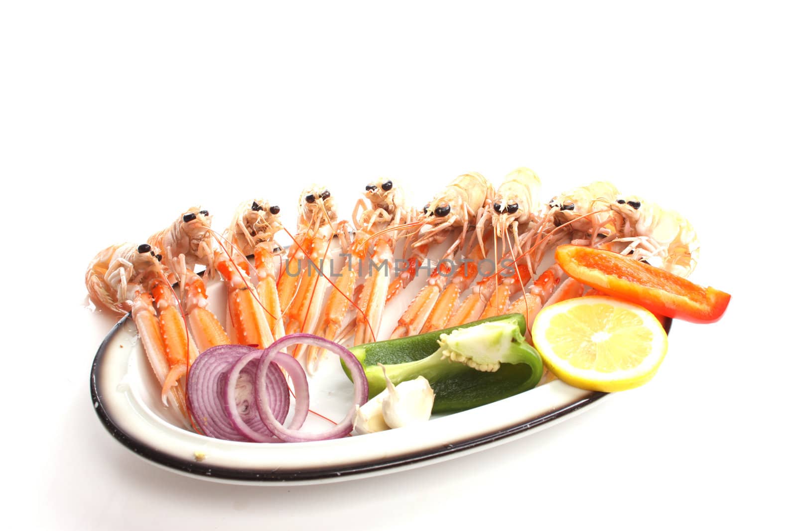 Cooked scampi on a dish  against a white background