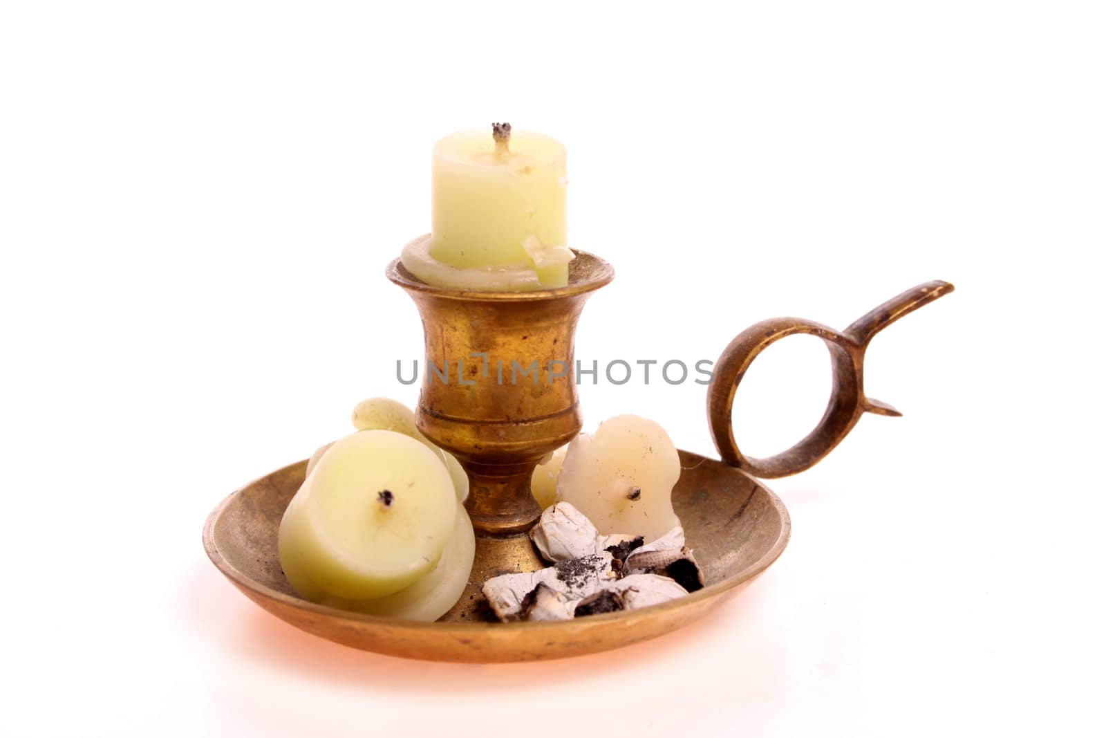 Candle used as an ashtray isolated against a white background with copy space