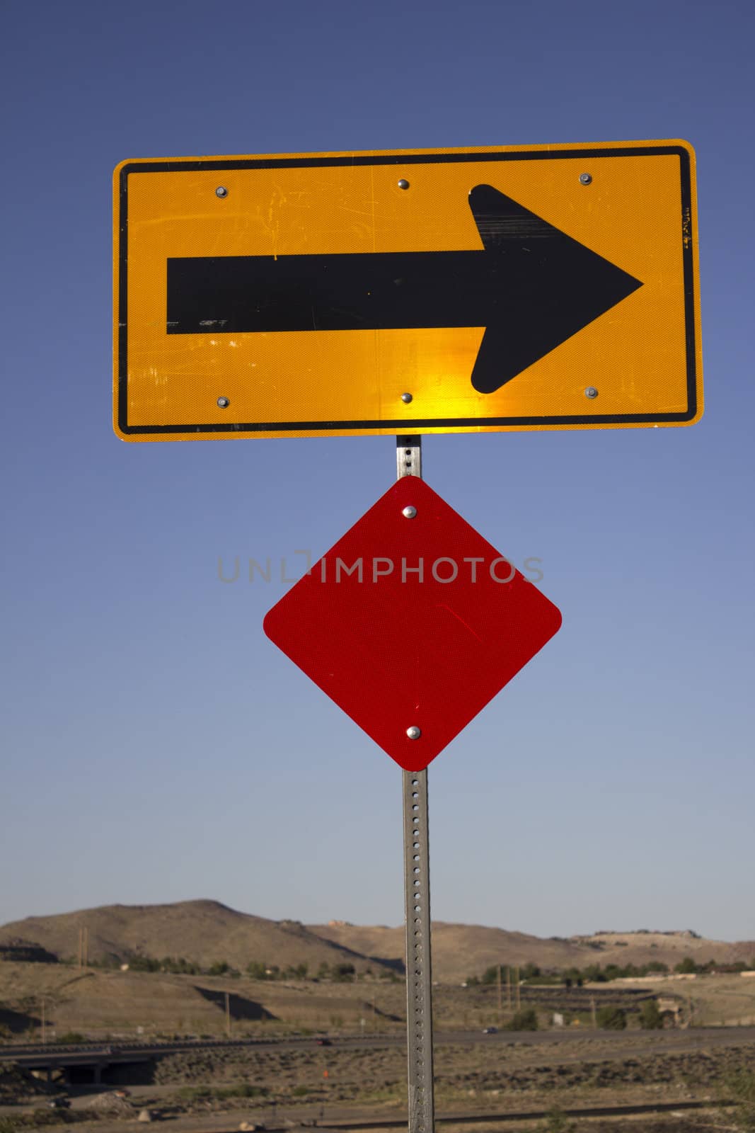 a right arrow road hazard sign