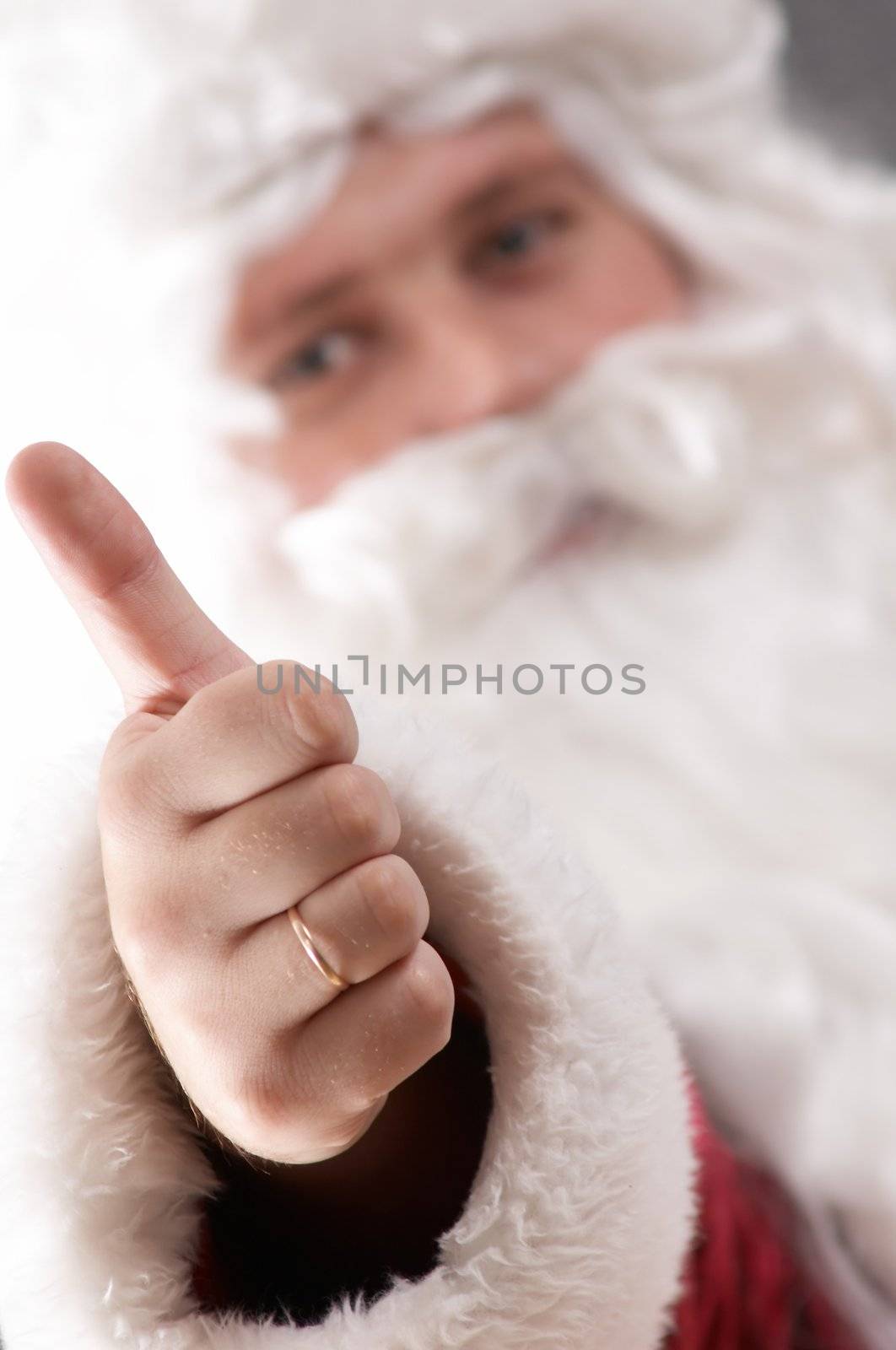 An image of Santa Claus showing his thumb