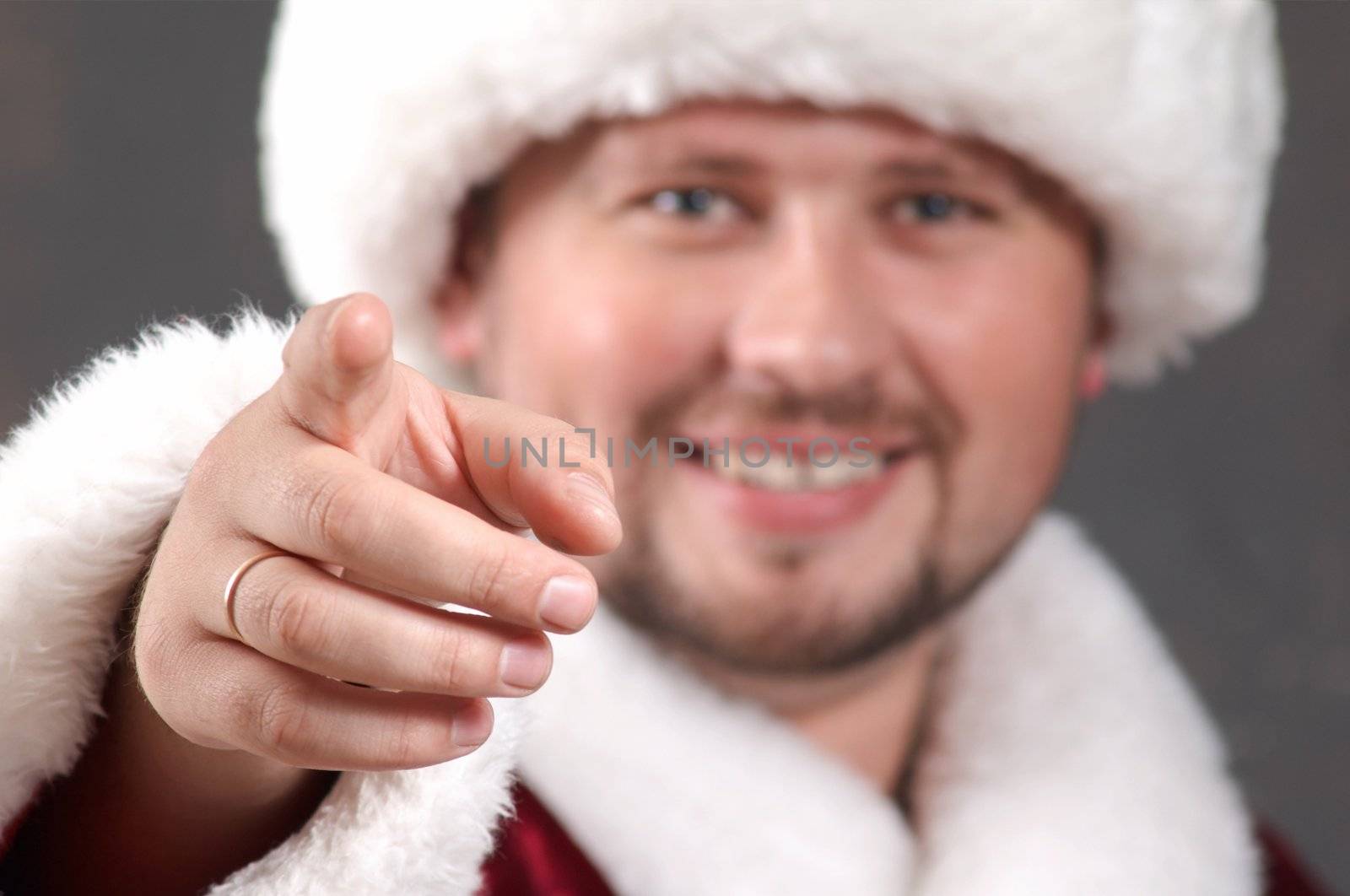 An inage of Santa Claus showing his forefinger