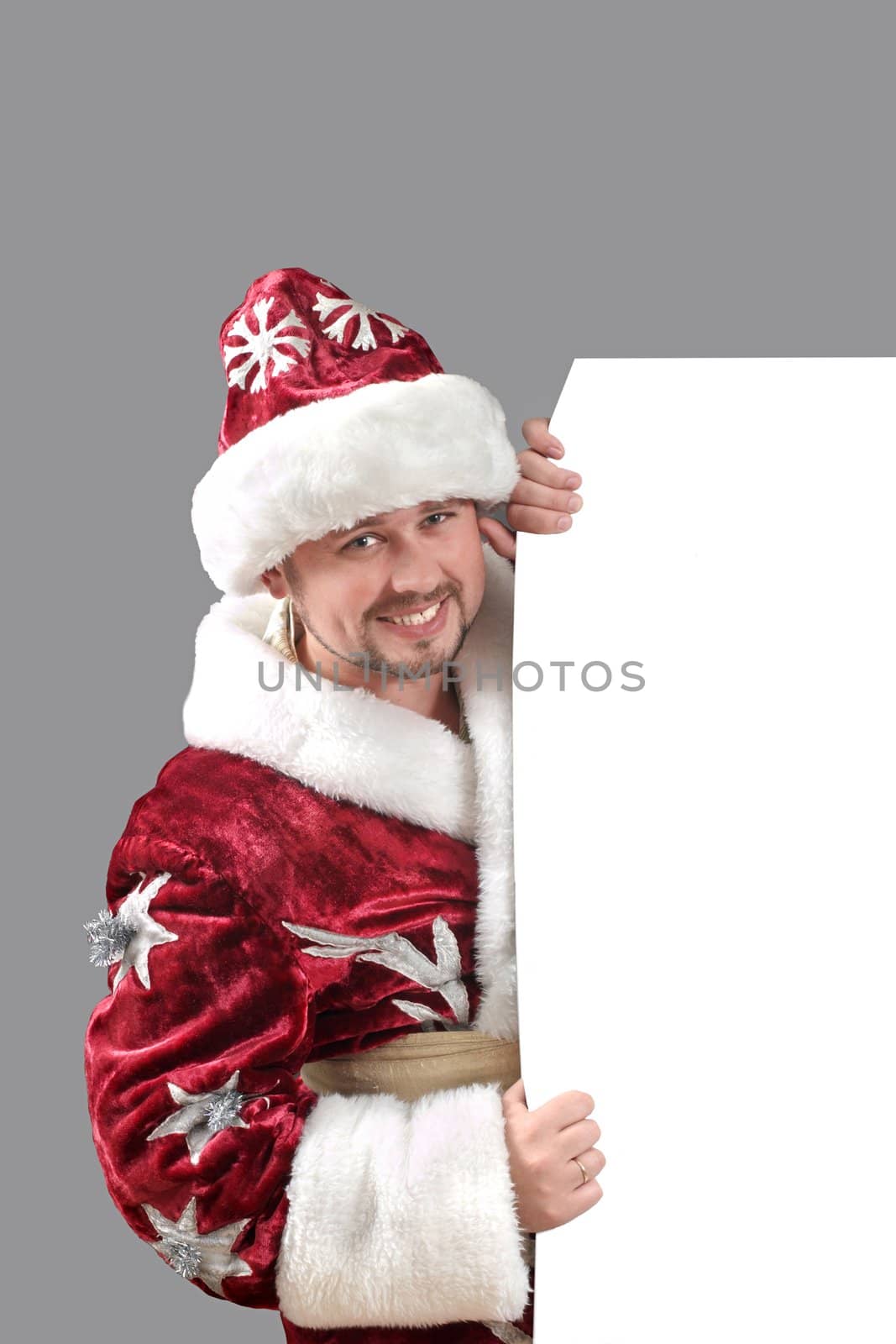 Santa Claus carrying a white paper for advertisement