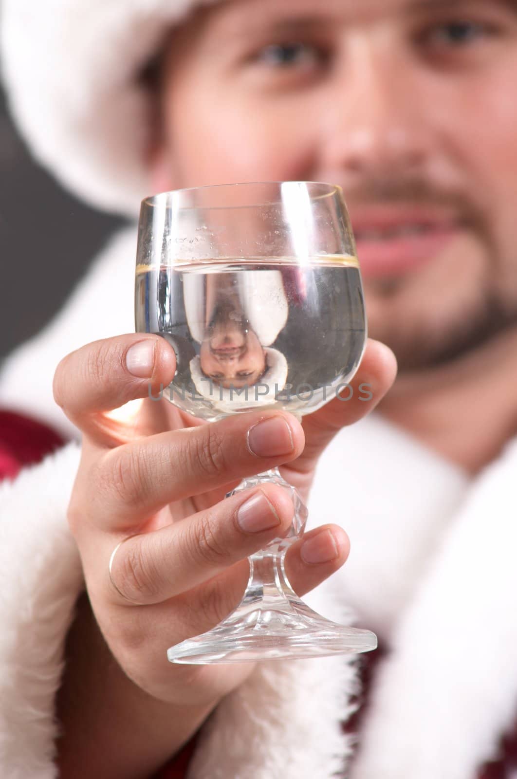 An image of Santa Claus drinking champagne