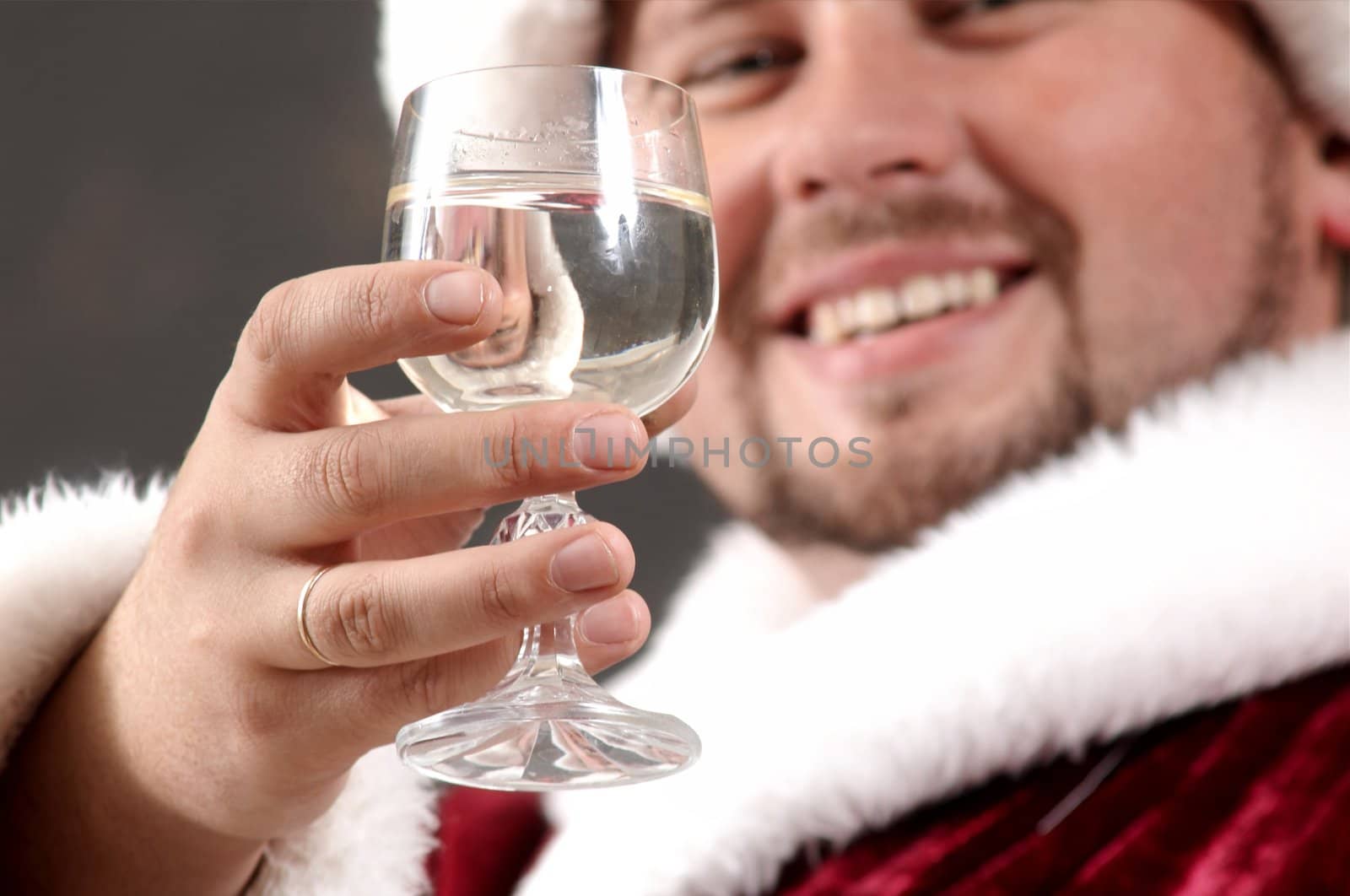 Santa Claus drinking champague in New Year night