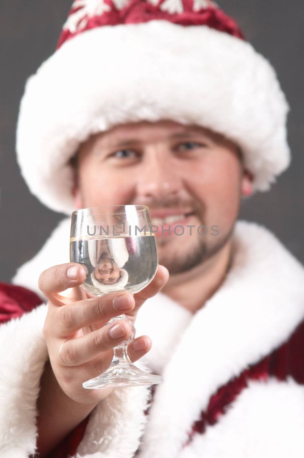 An image of Santa Claus drinking champagne
