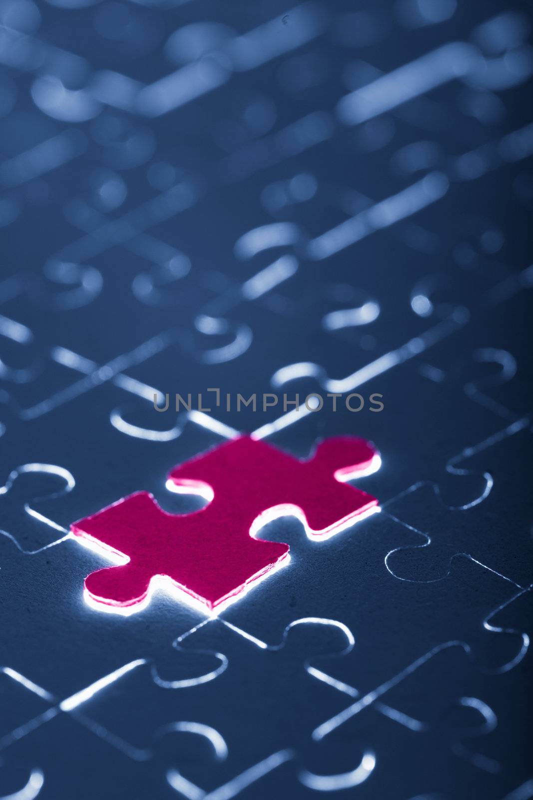 blue puzzle with one red piece
