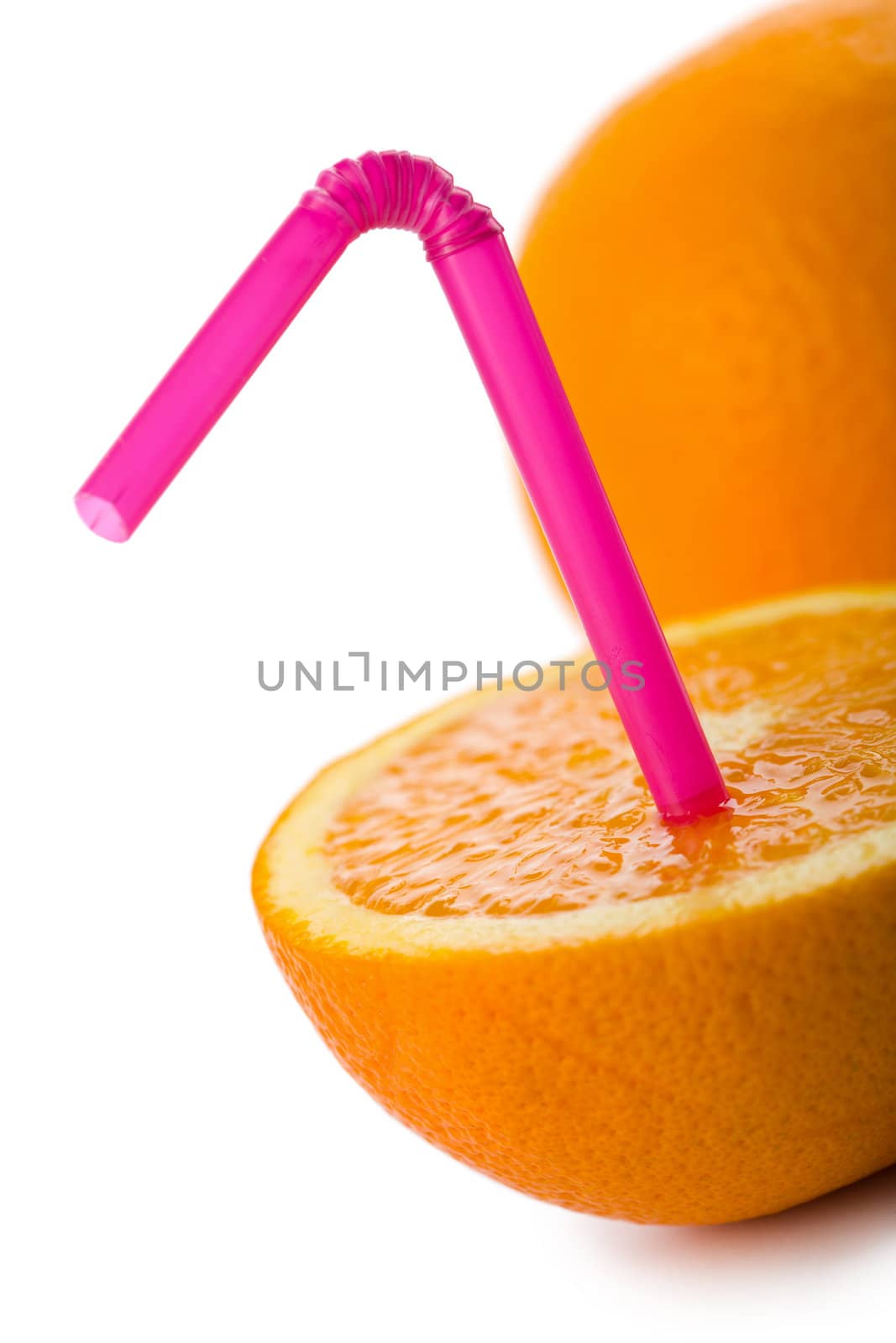 orange with straw isolated