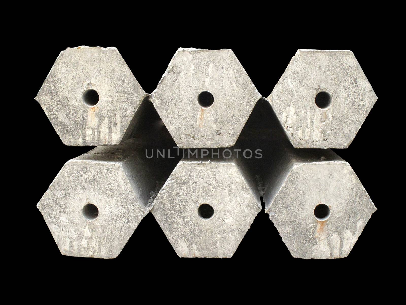 Hexagon concrete pillar on black background with clipping path