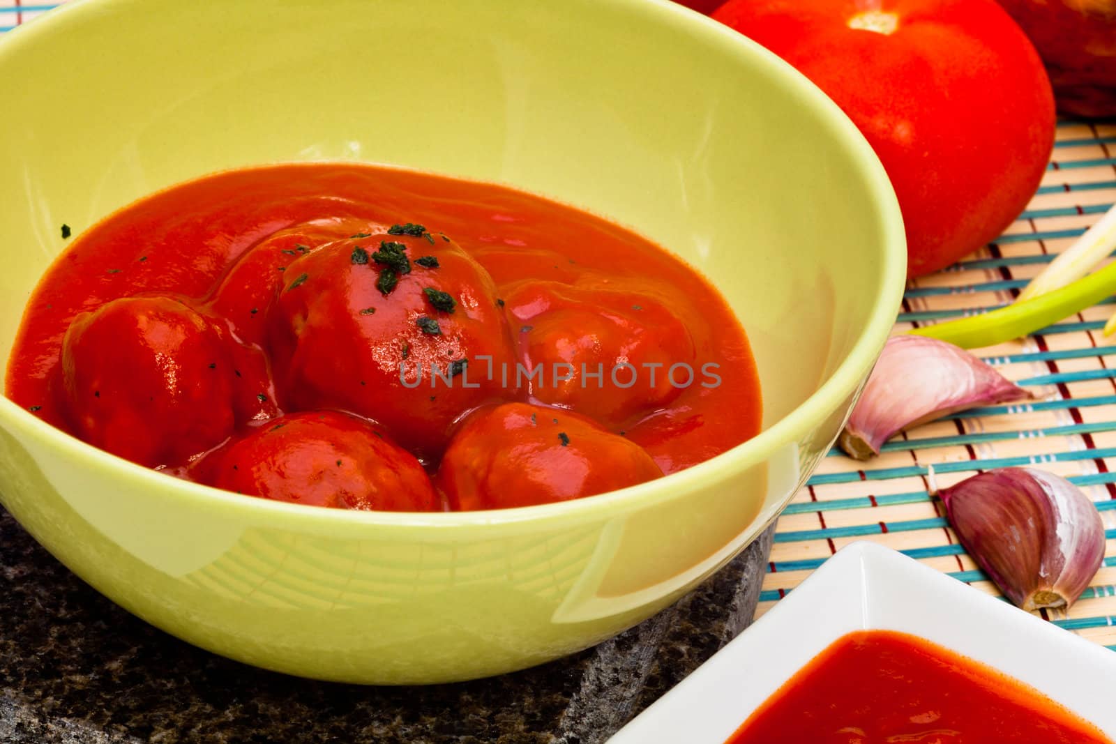 Bowl with meatballs and tomato sauce
