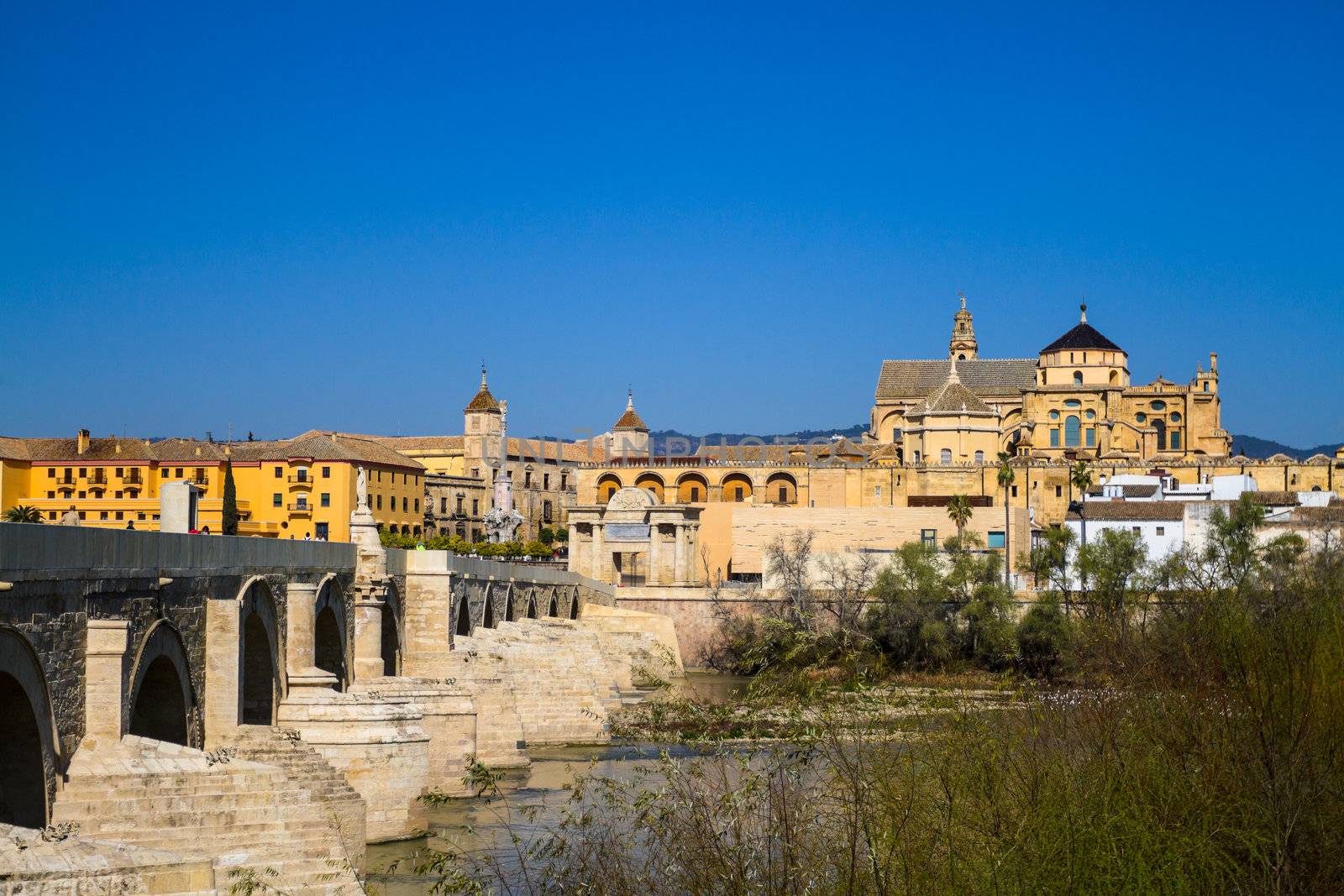 Cityscape of Cordoba with roman bridge and Mezquita, Andalusia, Spain