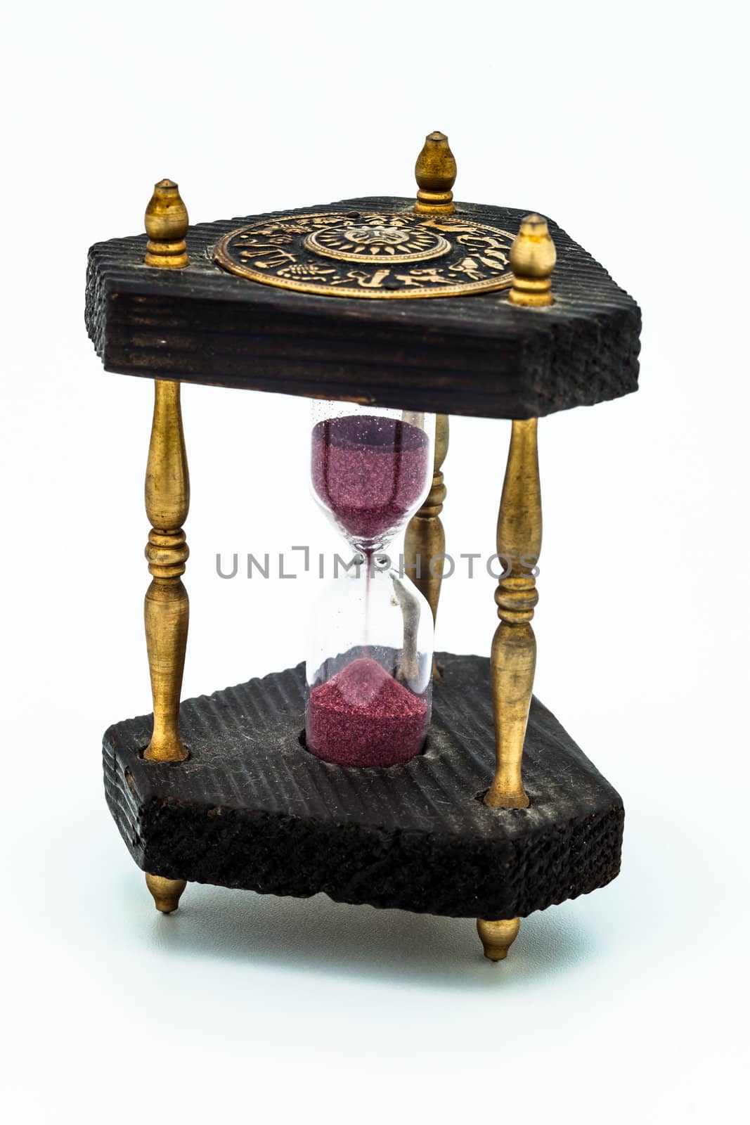 A wooden old sandglass isolated on white background