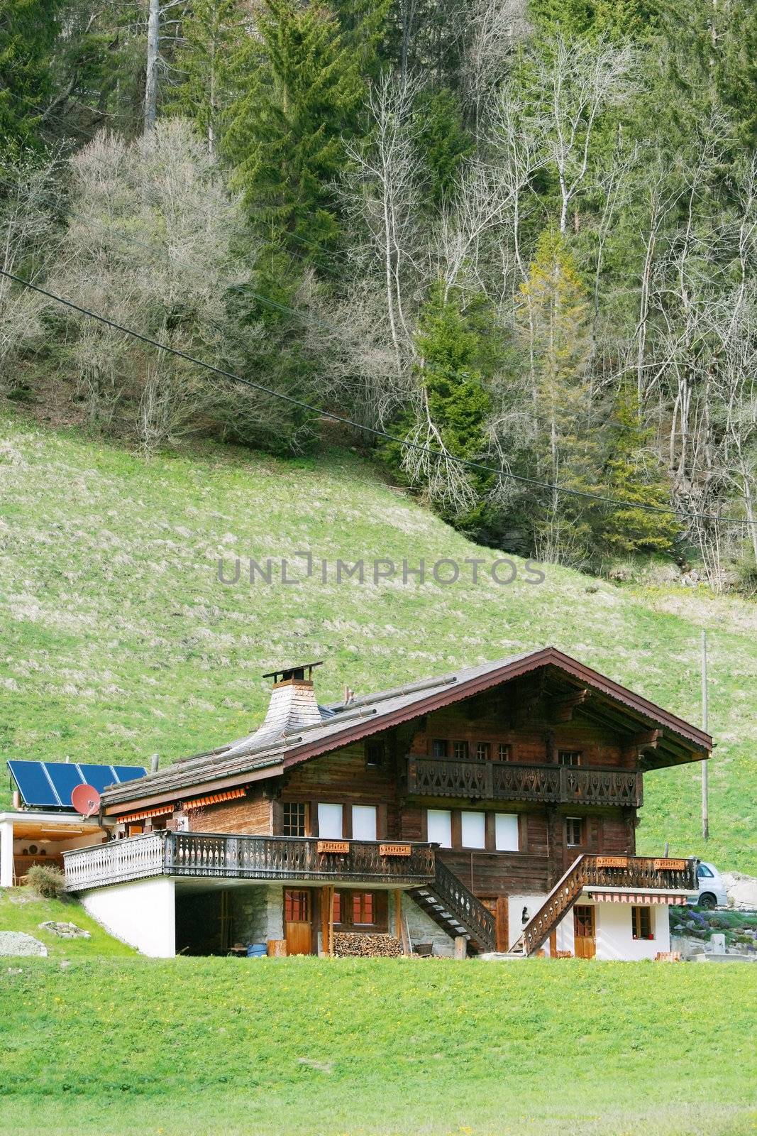Mountain wooden house in Swiss Alps by dacasdo