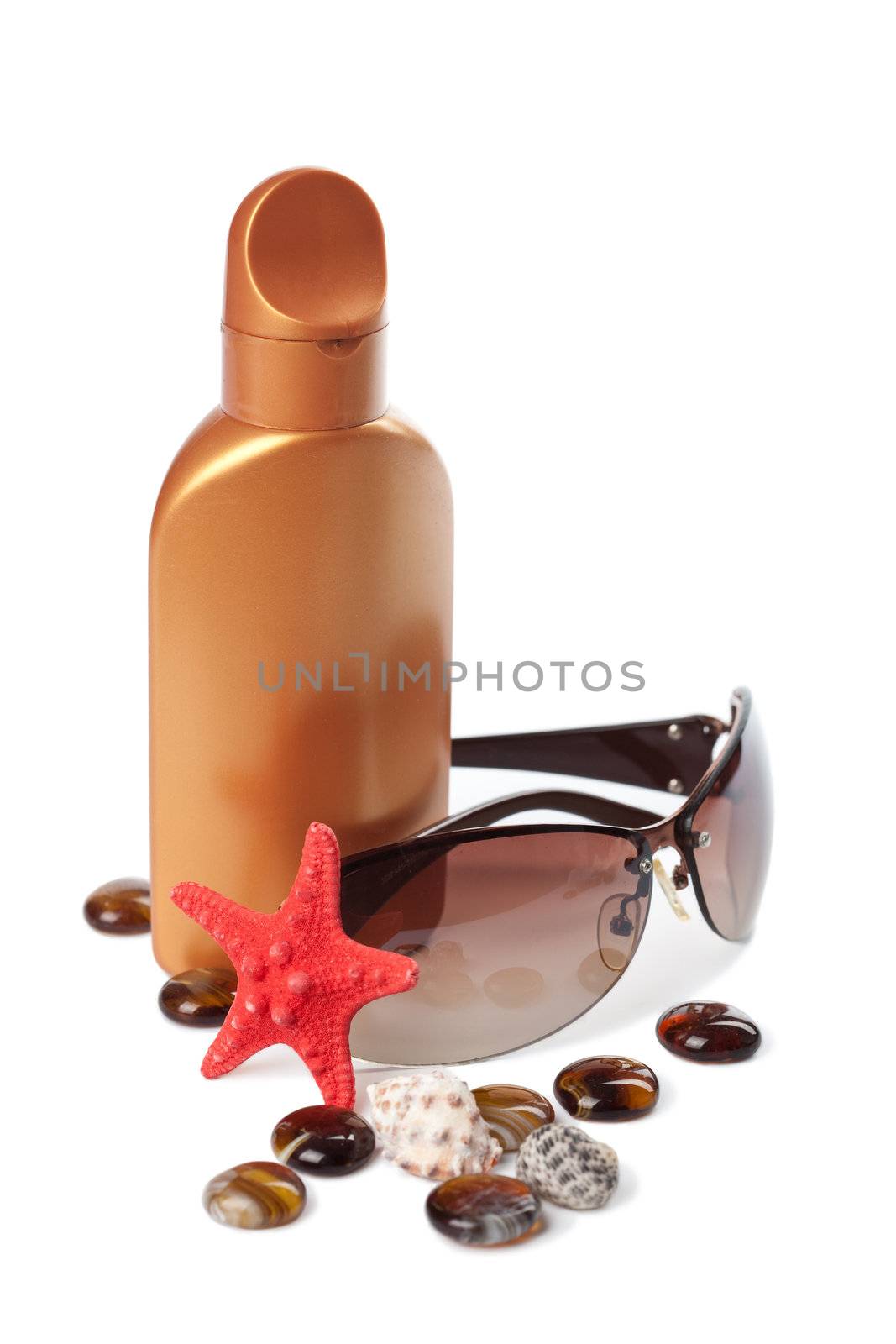 suntan lotion and sea shells isolated
