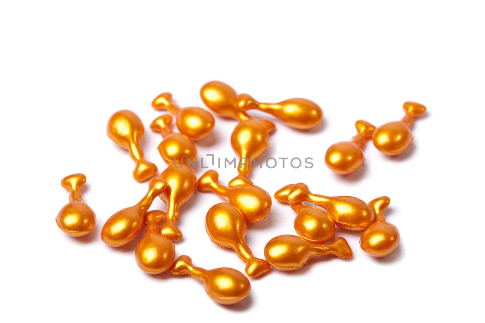 orange cosmetic capsules isolated 