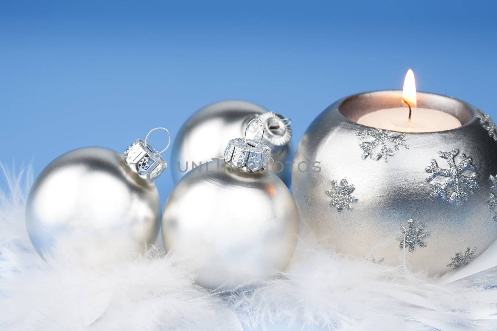 silver christmas balls and candle