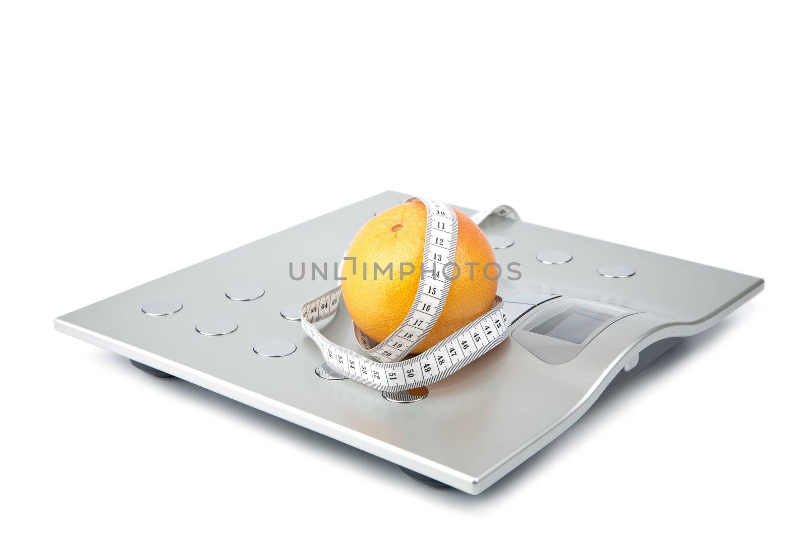 orange and measuring tape over scales isolated