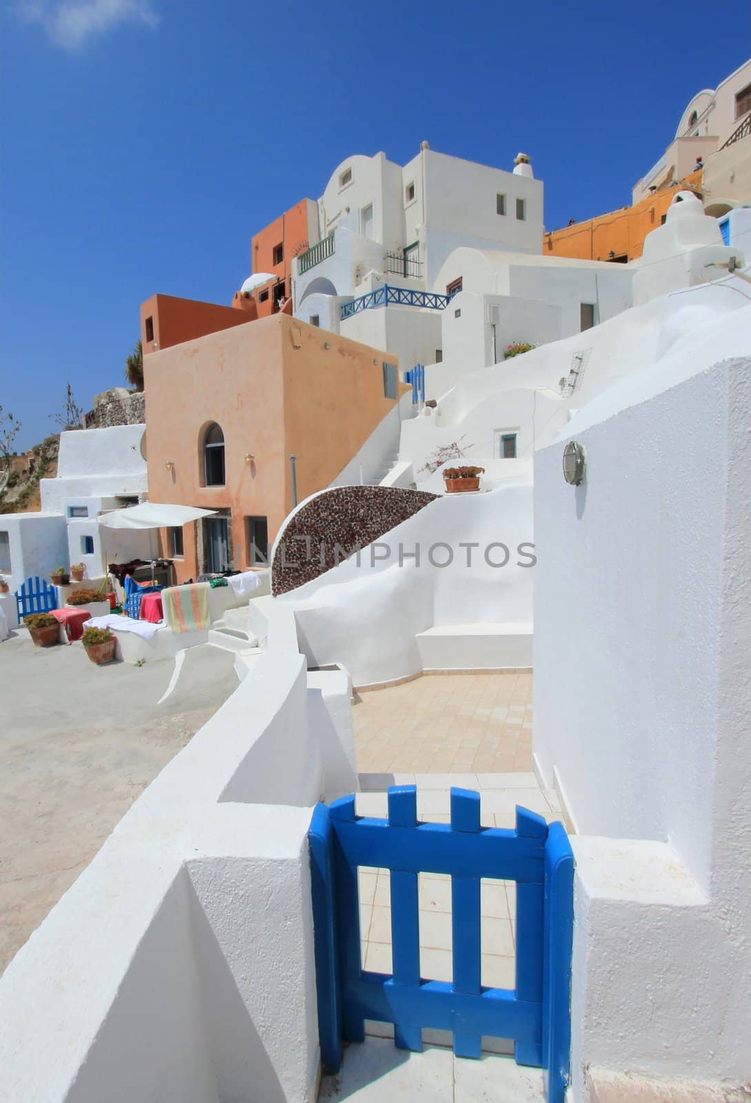 Colorful street architecture by beautiful weather, Oia, Santorini, Greece
