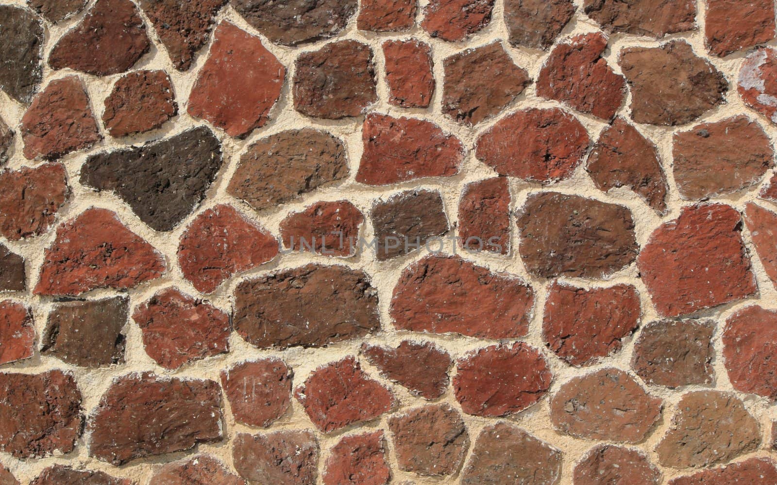 Texture of a wall made of red stones