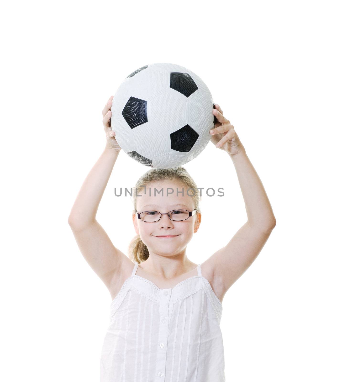 preteen girl with soccer ball held overhead isolated on white