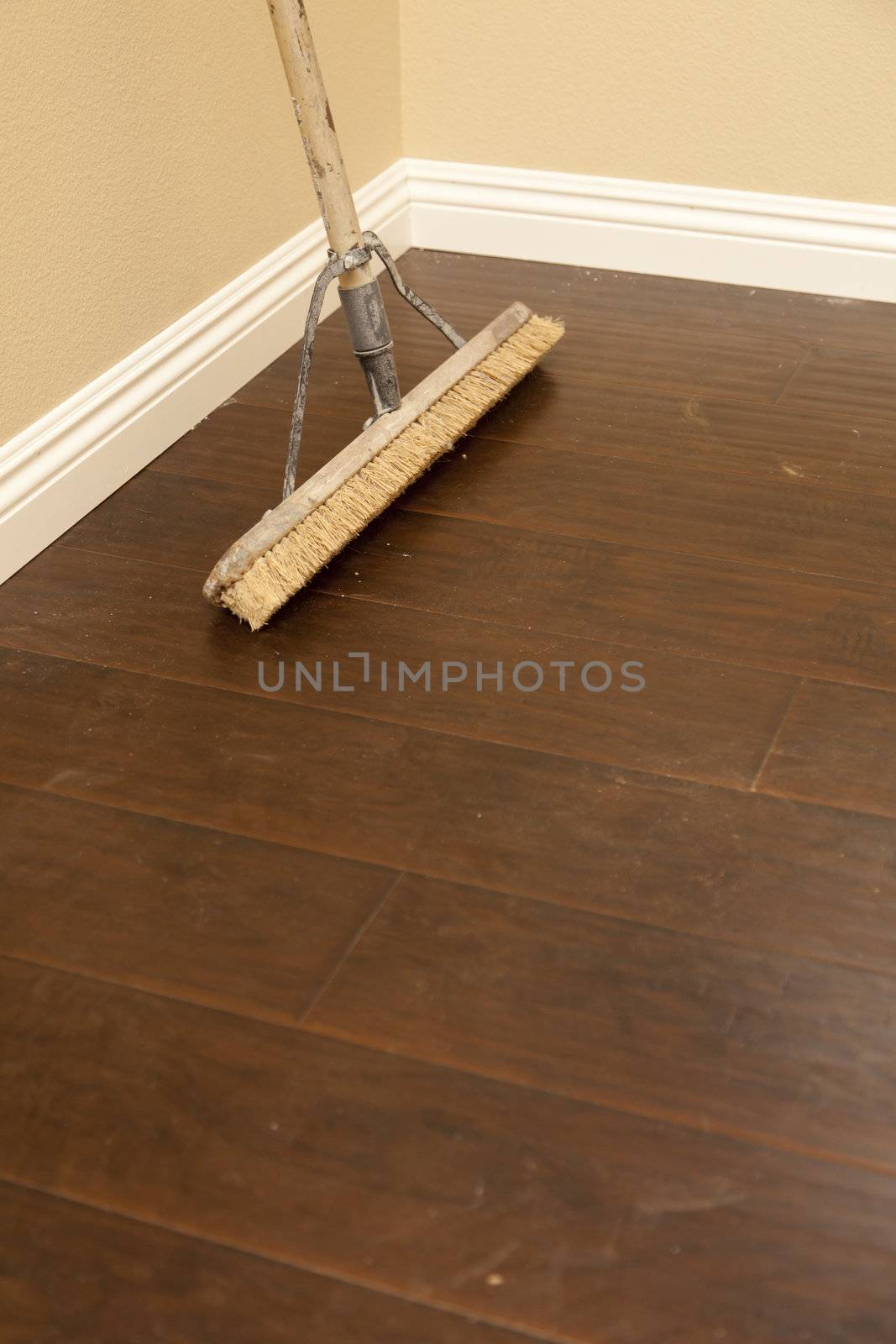 Push Broom on a Newly Installed Laminate Floor and Baseboard by Feverpitched