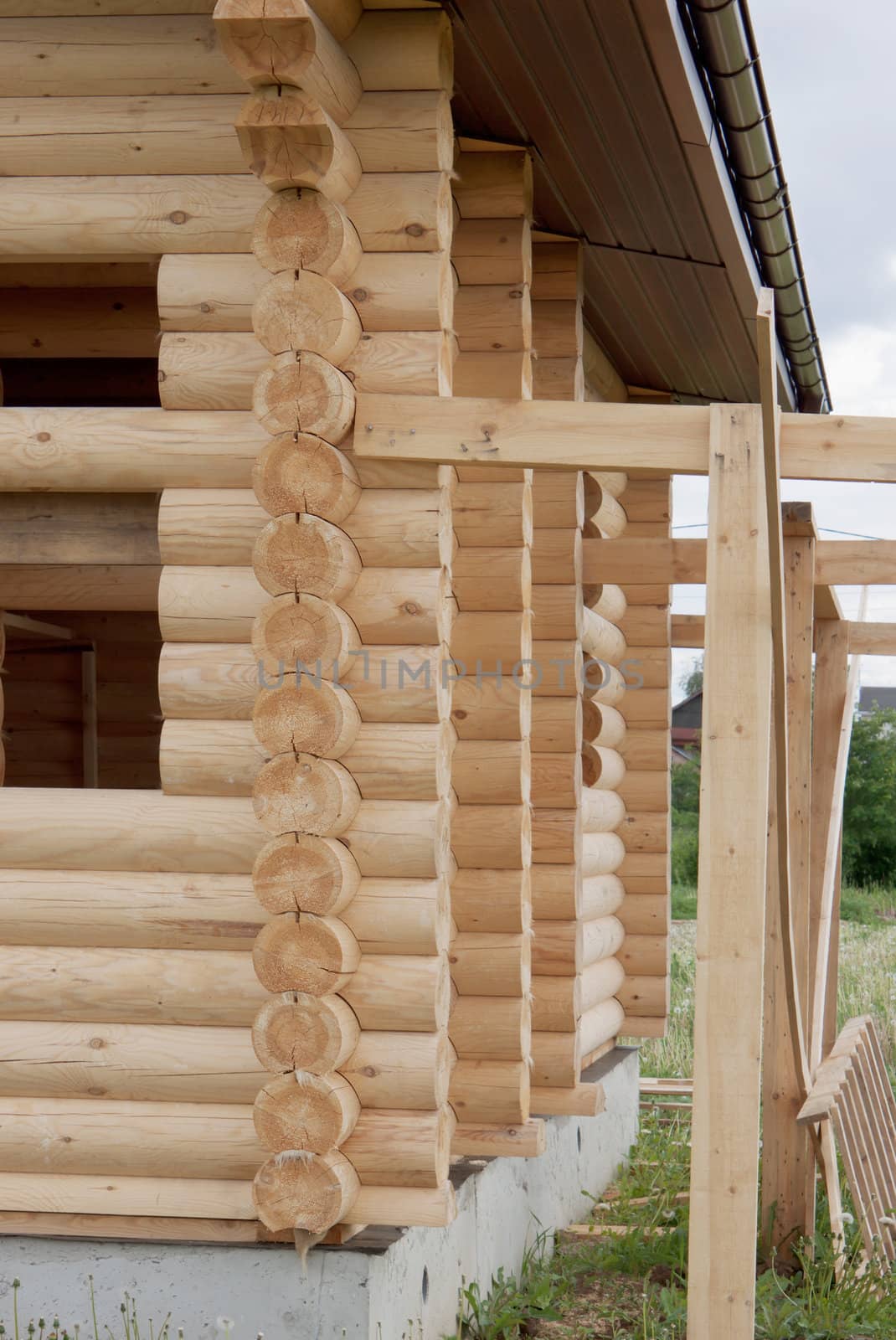 A fragment of a rural building of logs