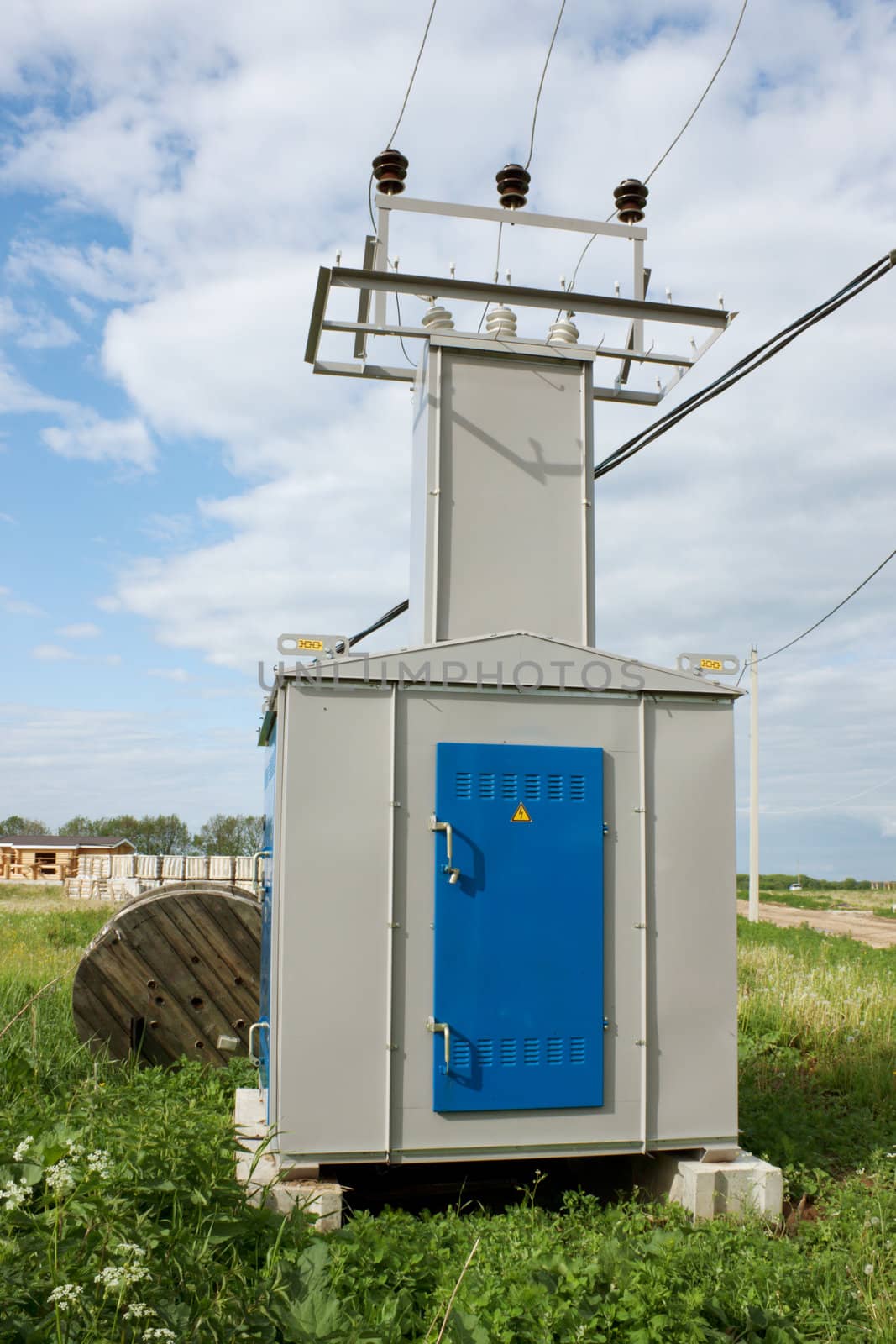 Transformer substation on a meadow in countryside
