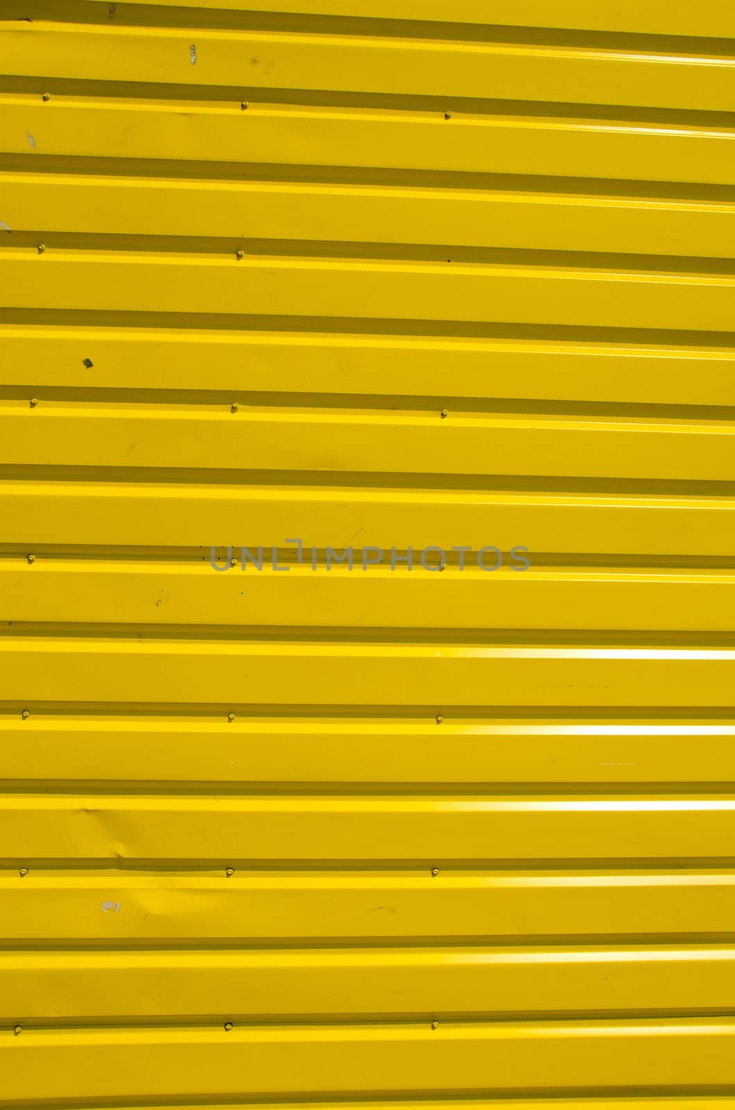 Wall made of wooden yellow planks. Interesting background.