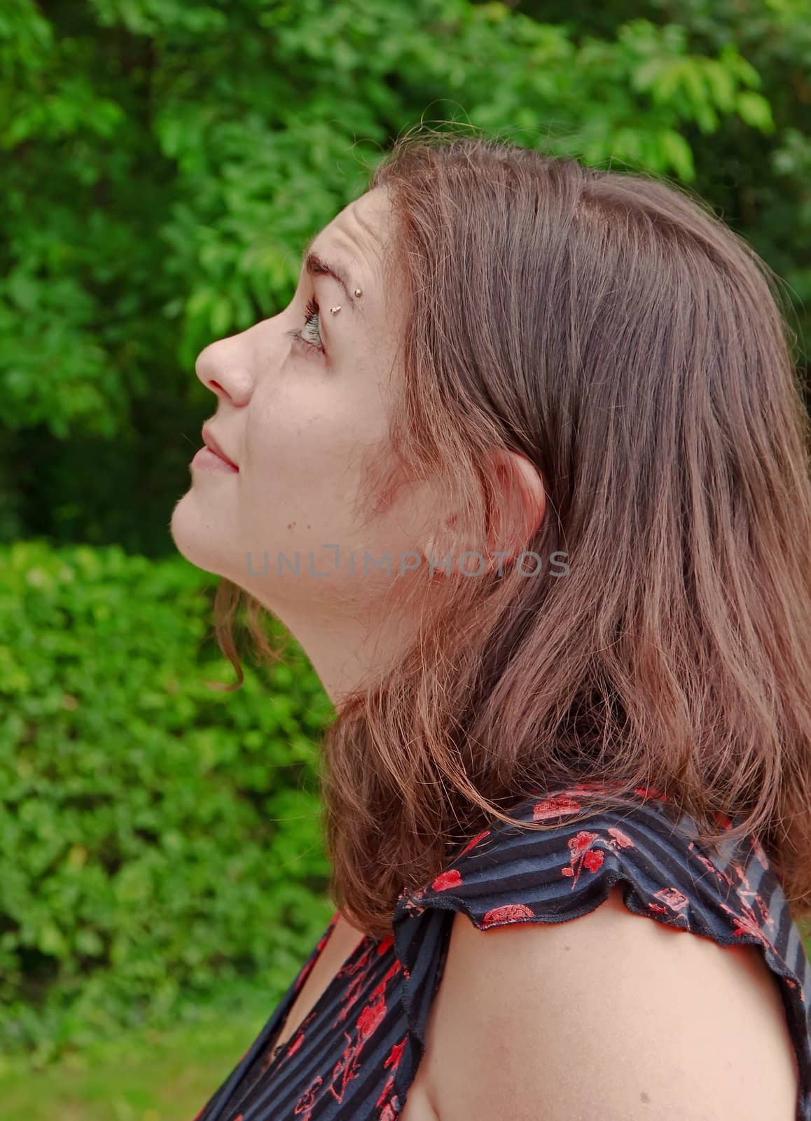 Moment of attention, focused young woman looking at something carefully