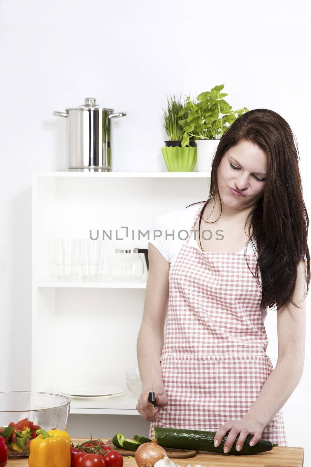 young woman is not happy about the working in her kitchen