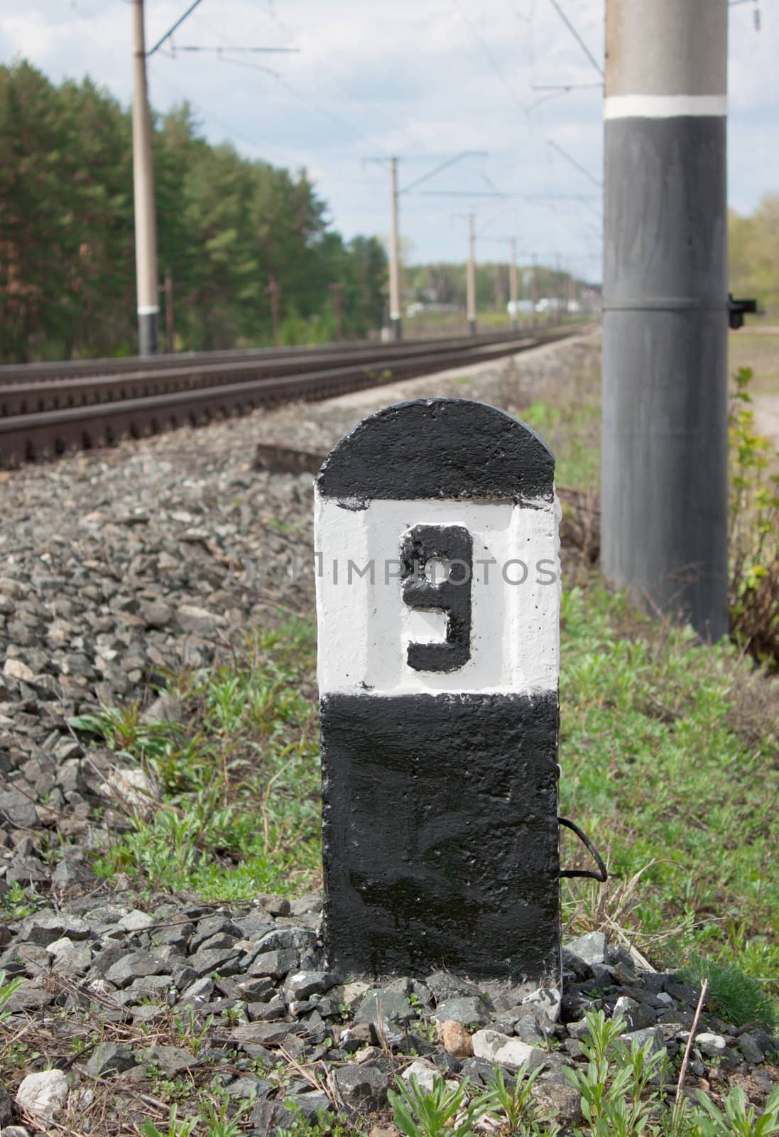 Column at the railway with the number