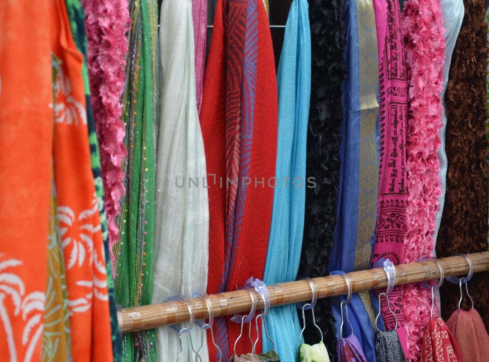 Colorful fabric on a rack at an outdoor shop
