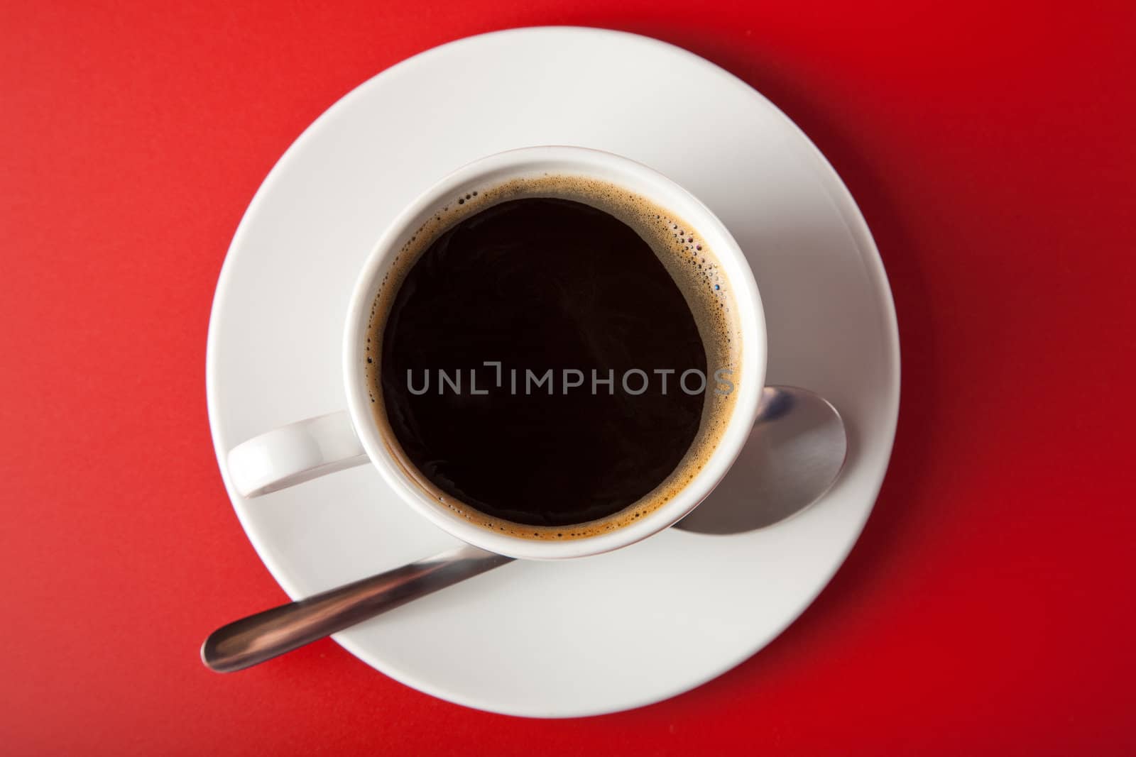 cup of coffee over red background
