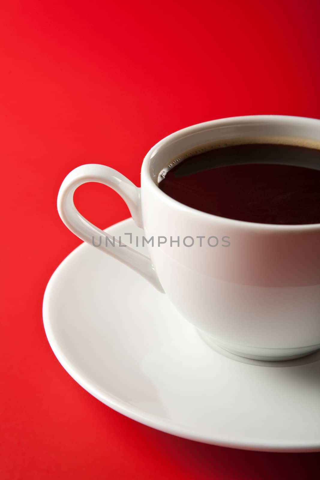 cup of coffee over red background
