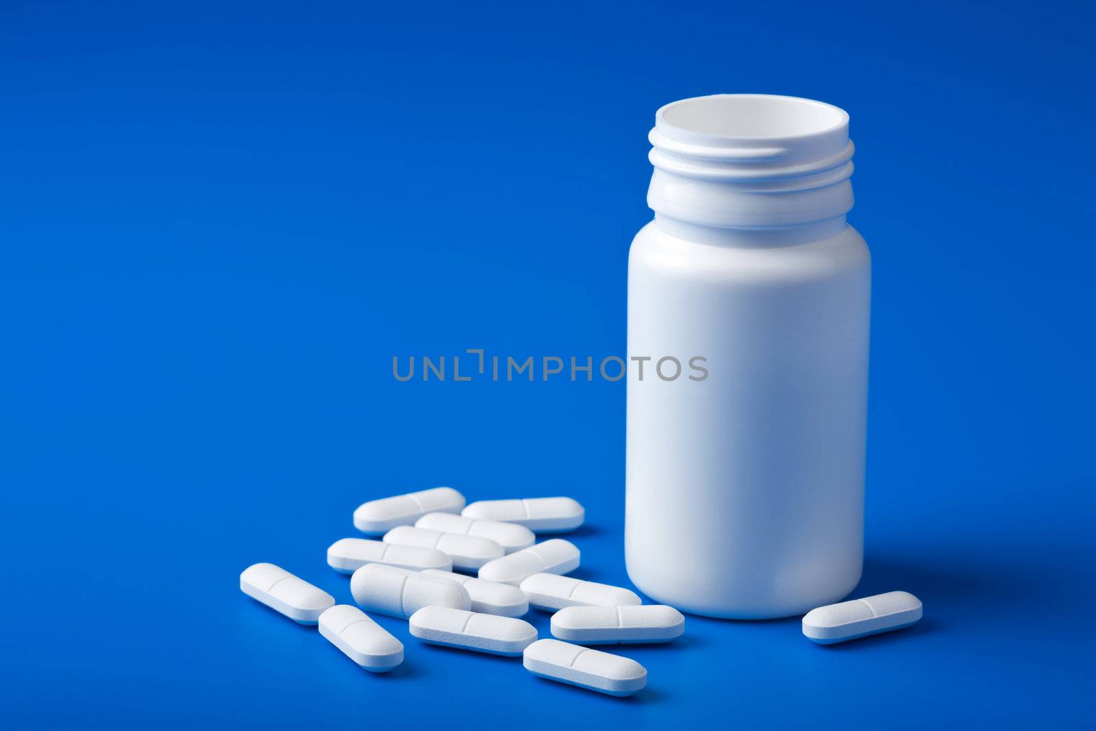 white pills over blue
