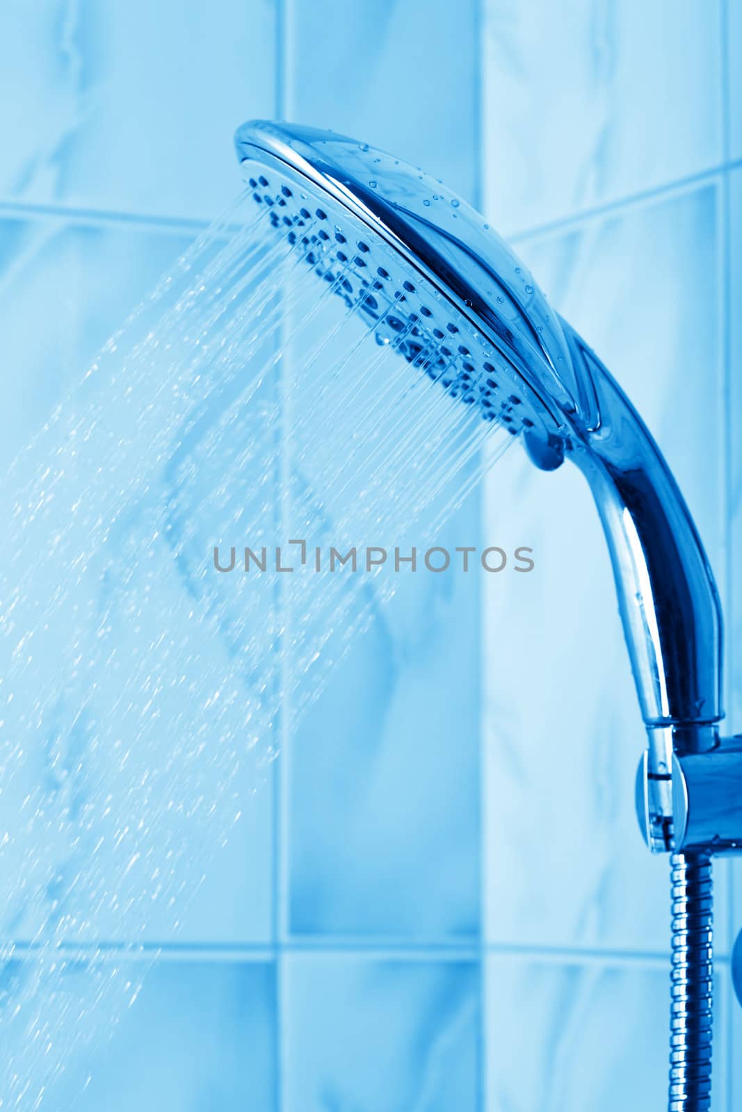 water flowing from metal shower
