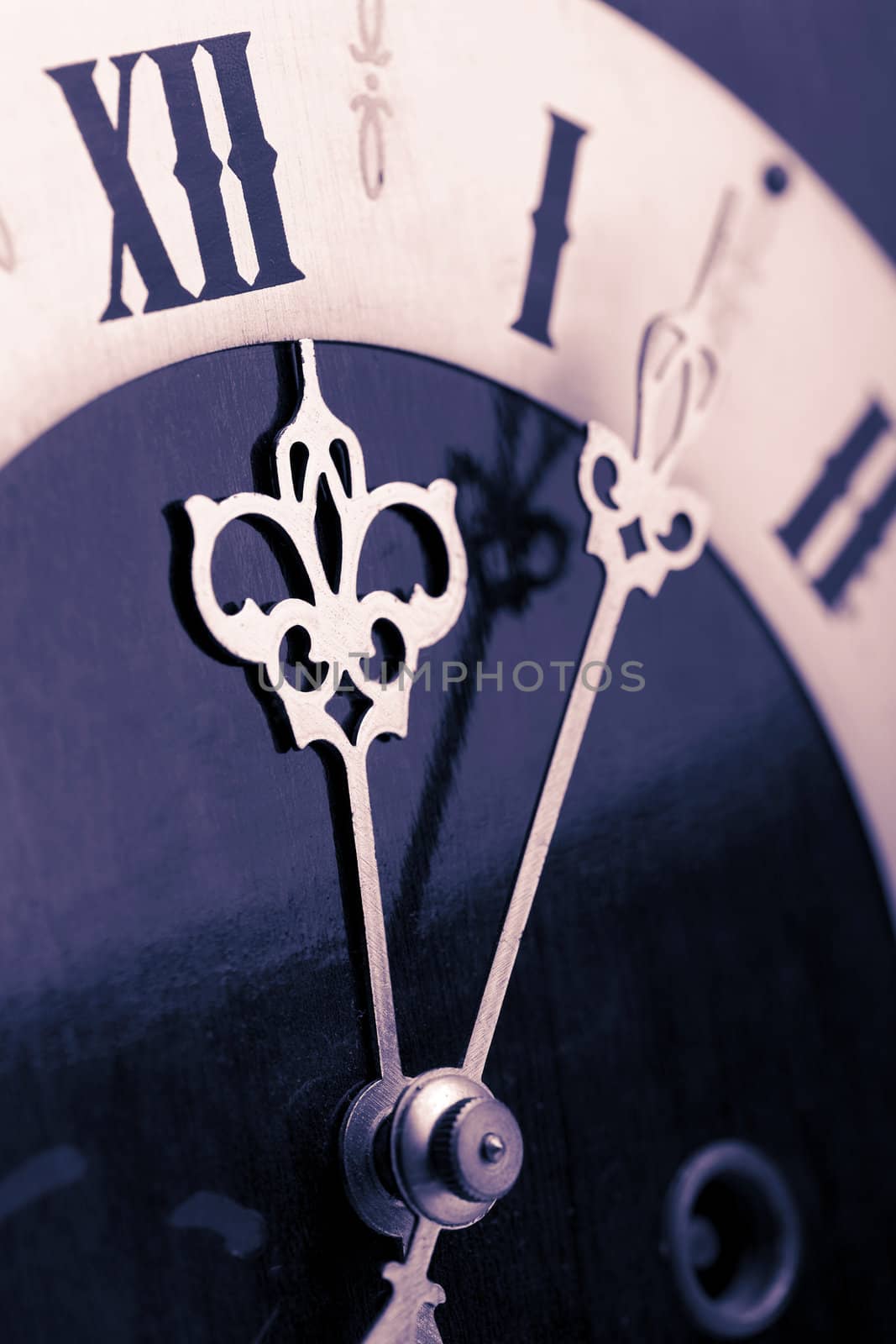 antique clock showing time about twelve 