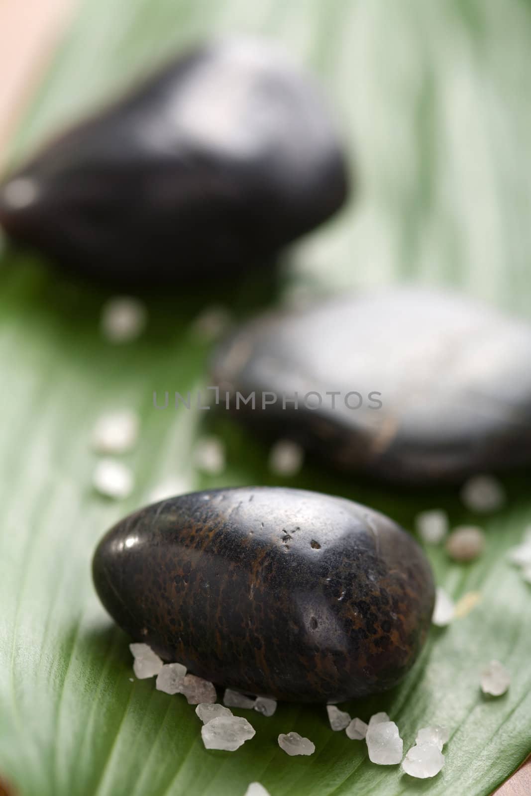 black spa stones and leaf
