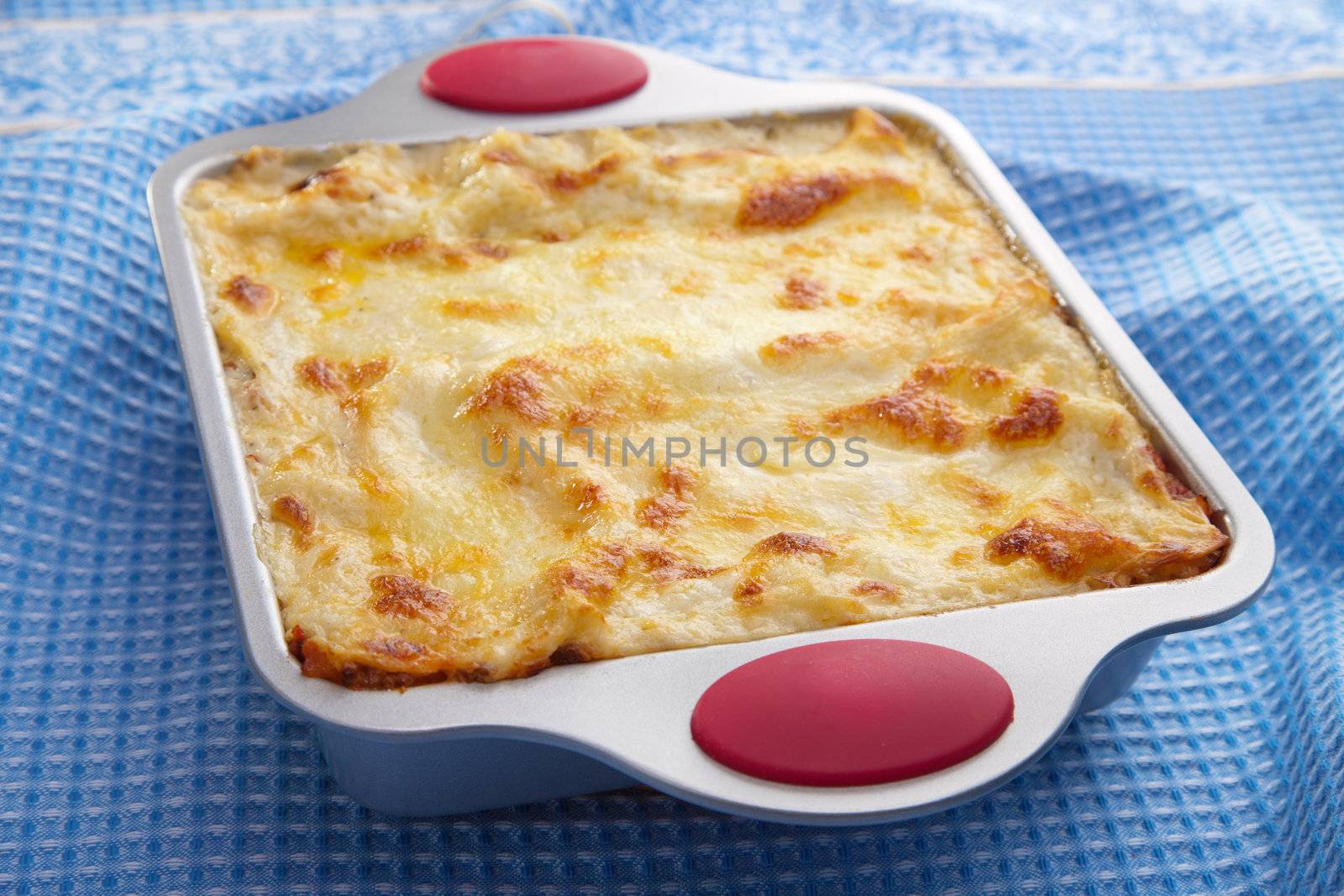classic lasagna over blue cloth