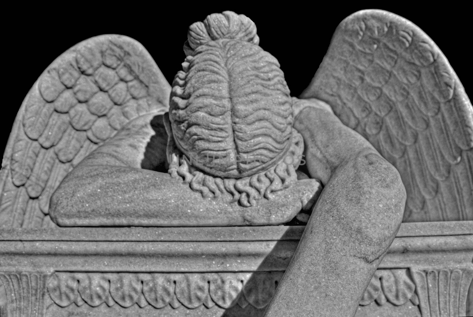 Black and white view of crying angel monument