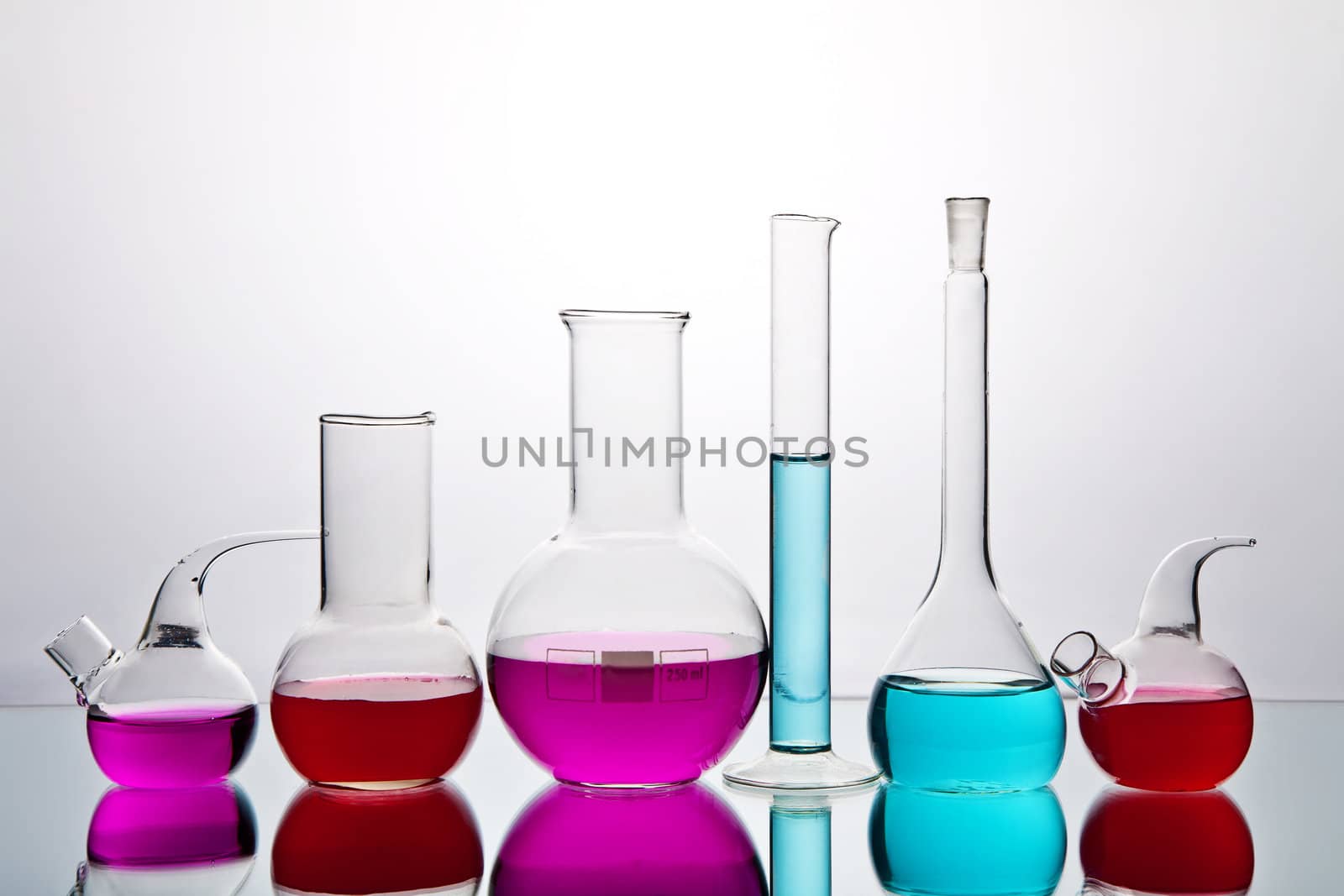 laboratory glassware with colorful chemicals