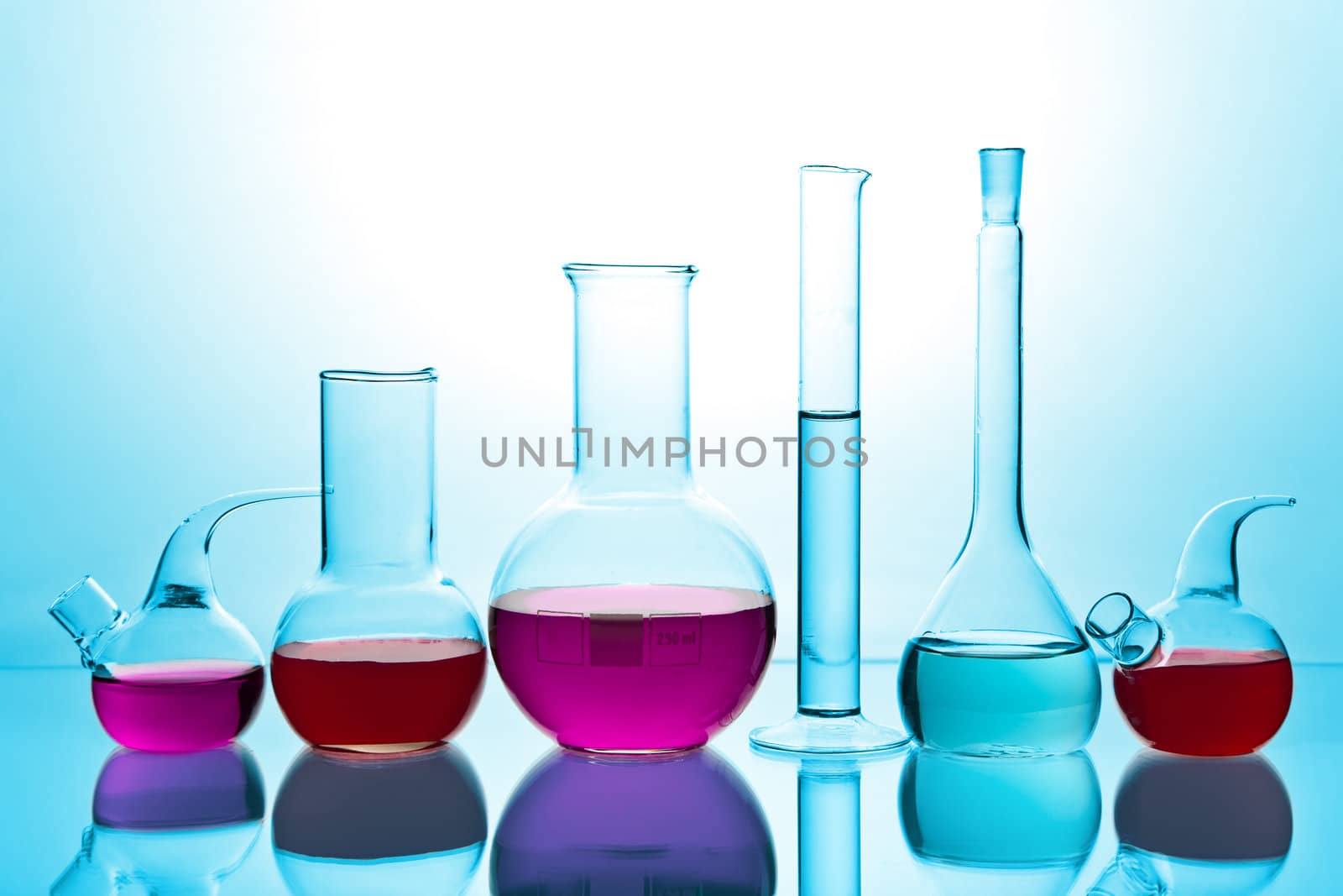 laboratory glassware with colorful chemicals