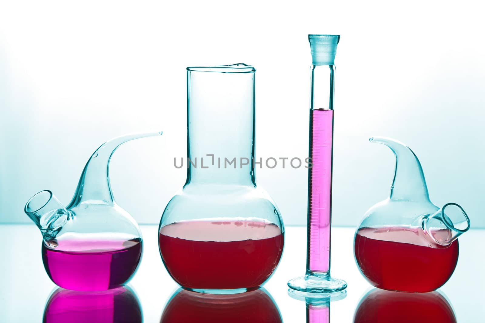 laboratory glassware with colorful chemicals 