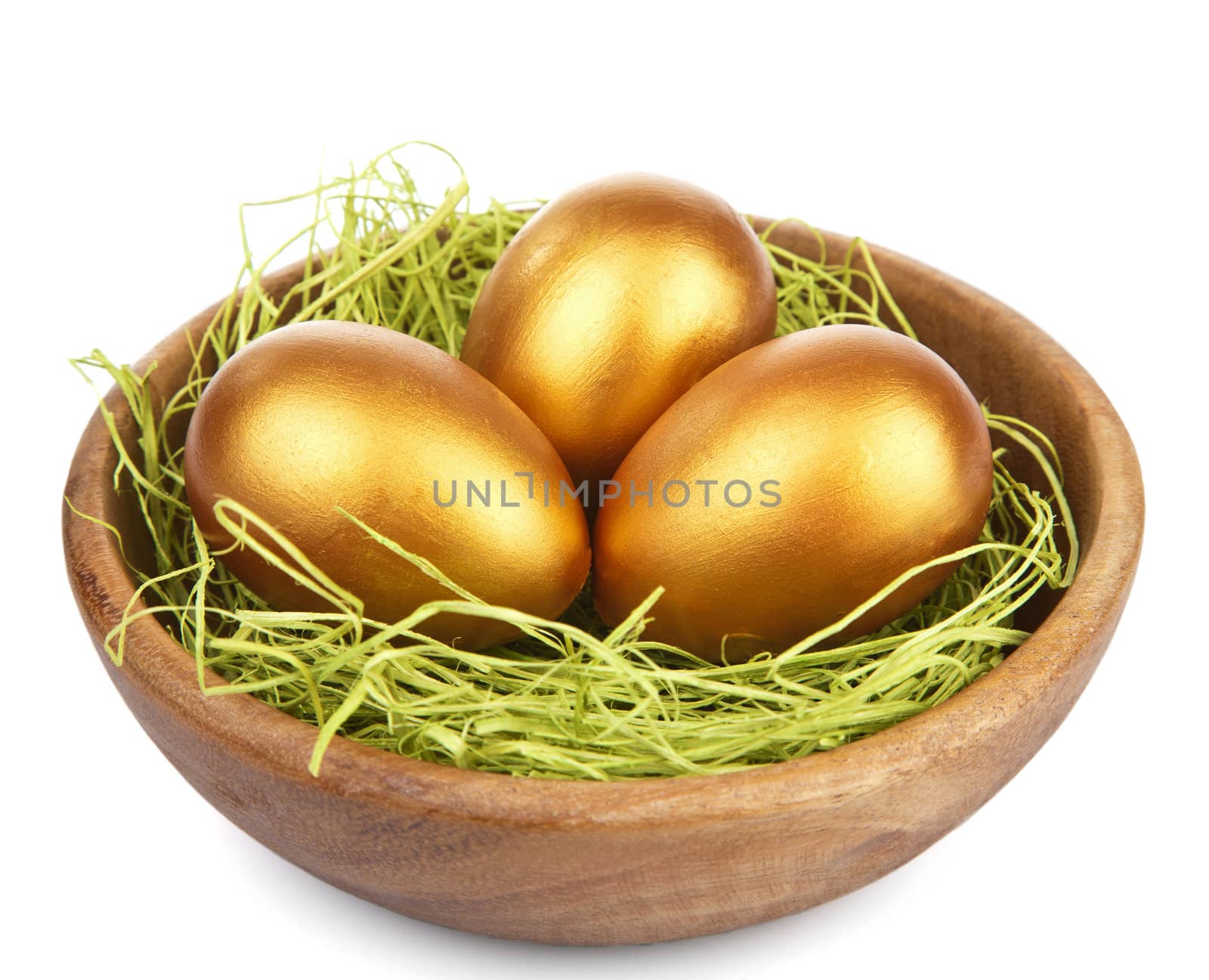 golden easter eggs in bowl isolated 